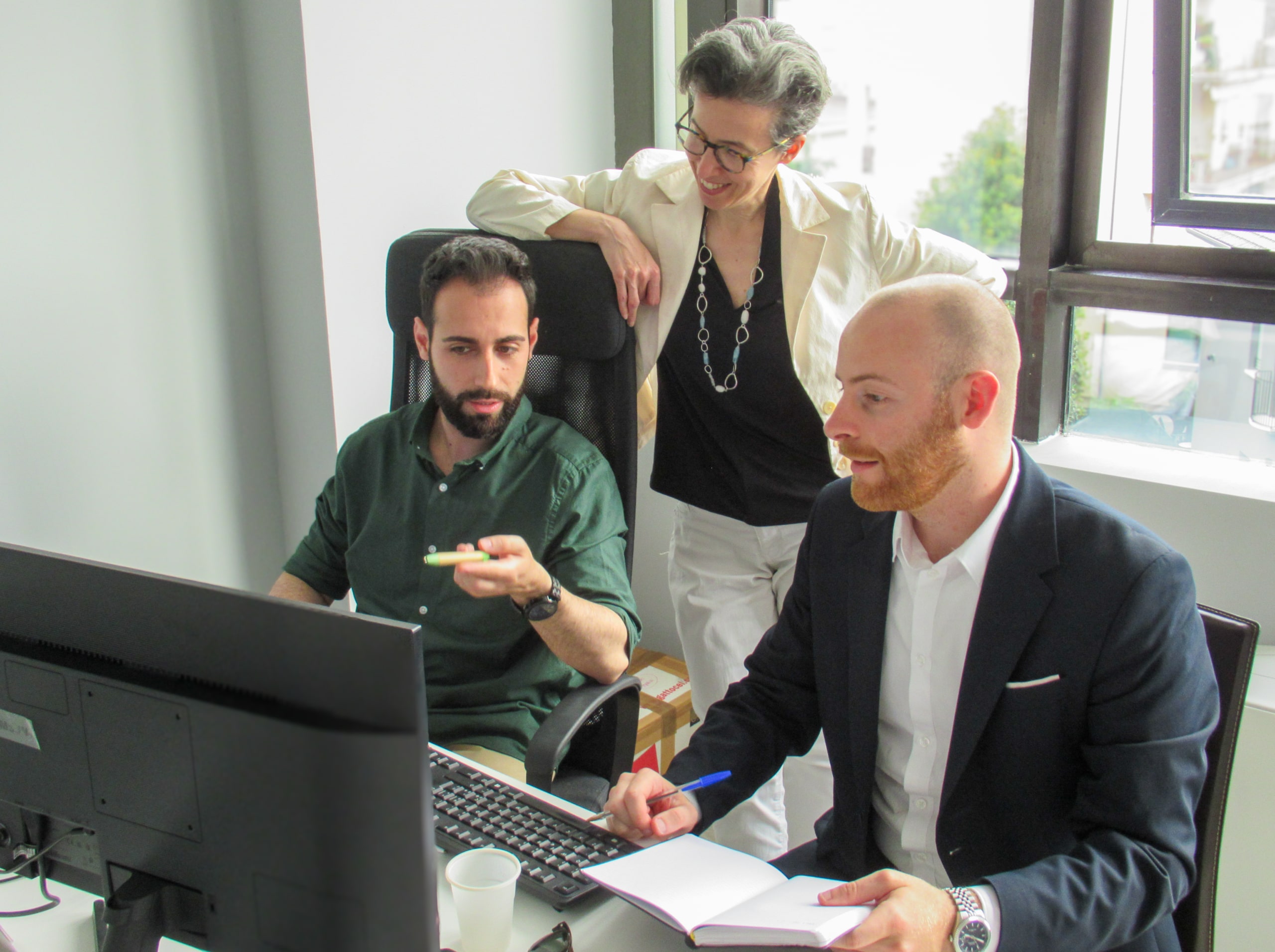 Giacomo Barbi working with colleagues at Laketricity Italy